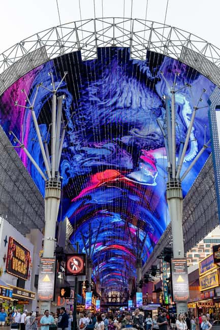 Las Vegas: Fremont Experience Guided Walking Tour & Drinks - Entering the Fremont Experience from the Plaza Hotel corner